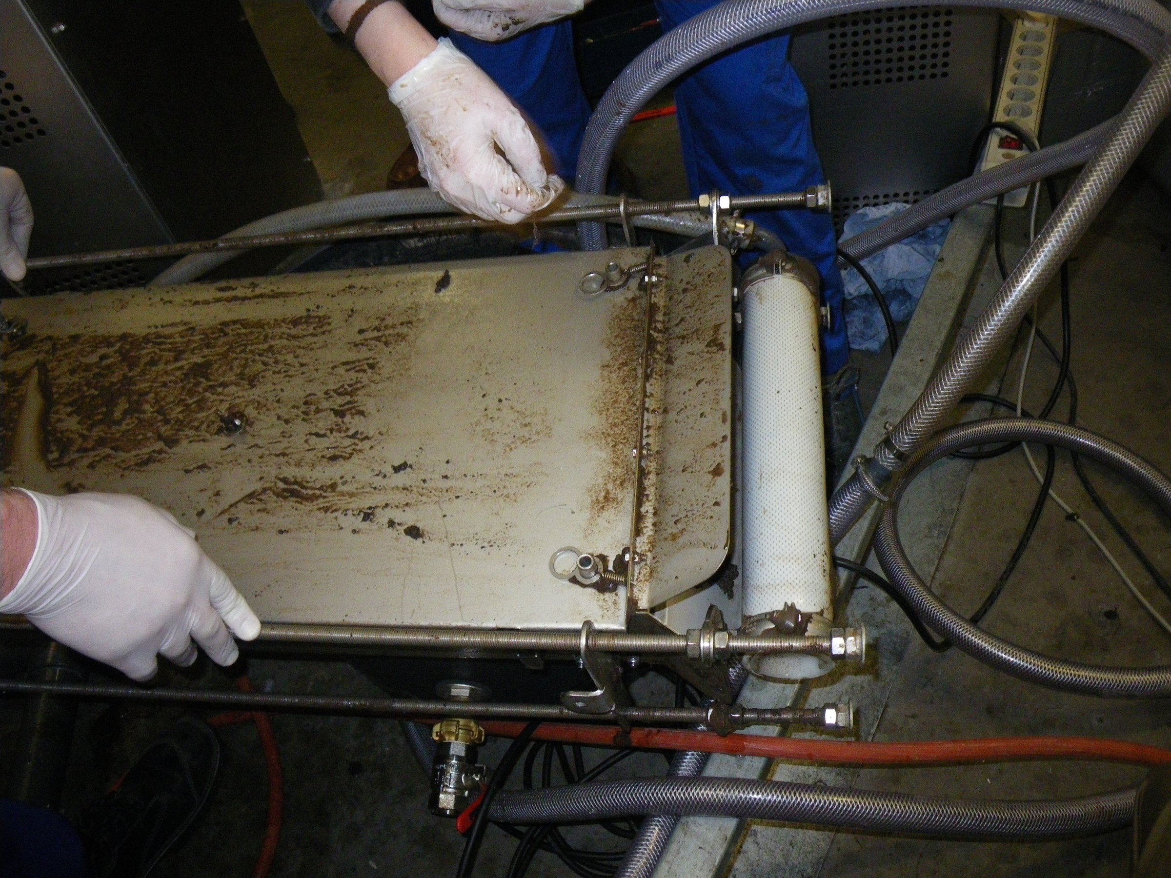 Technician inspecting an MBR membrane cassette and its scouring-aeration assembly