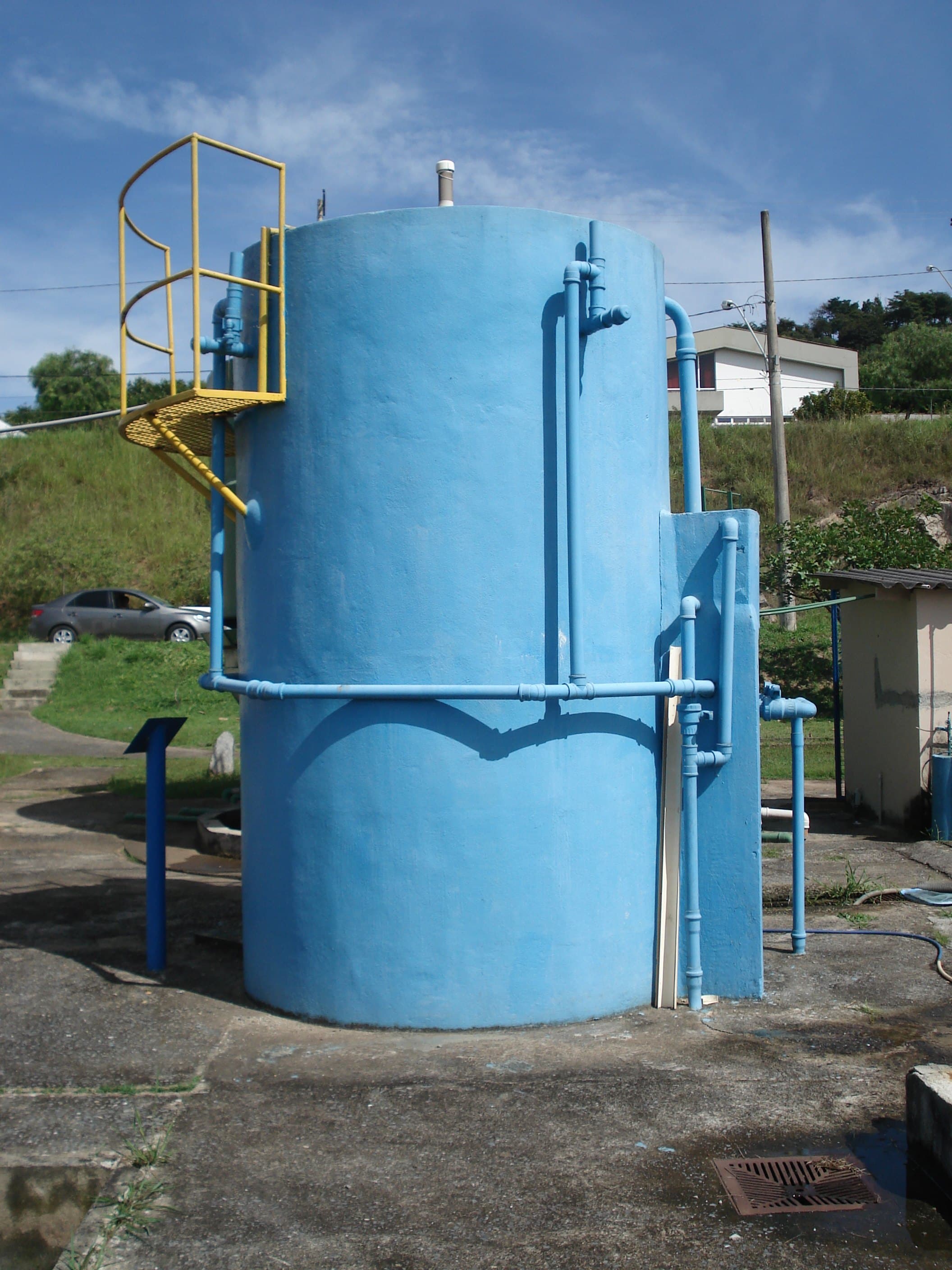 Vertical pilot-scale UASB reactor with process piping at a wastewater treatment site
